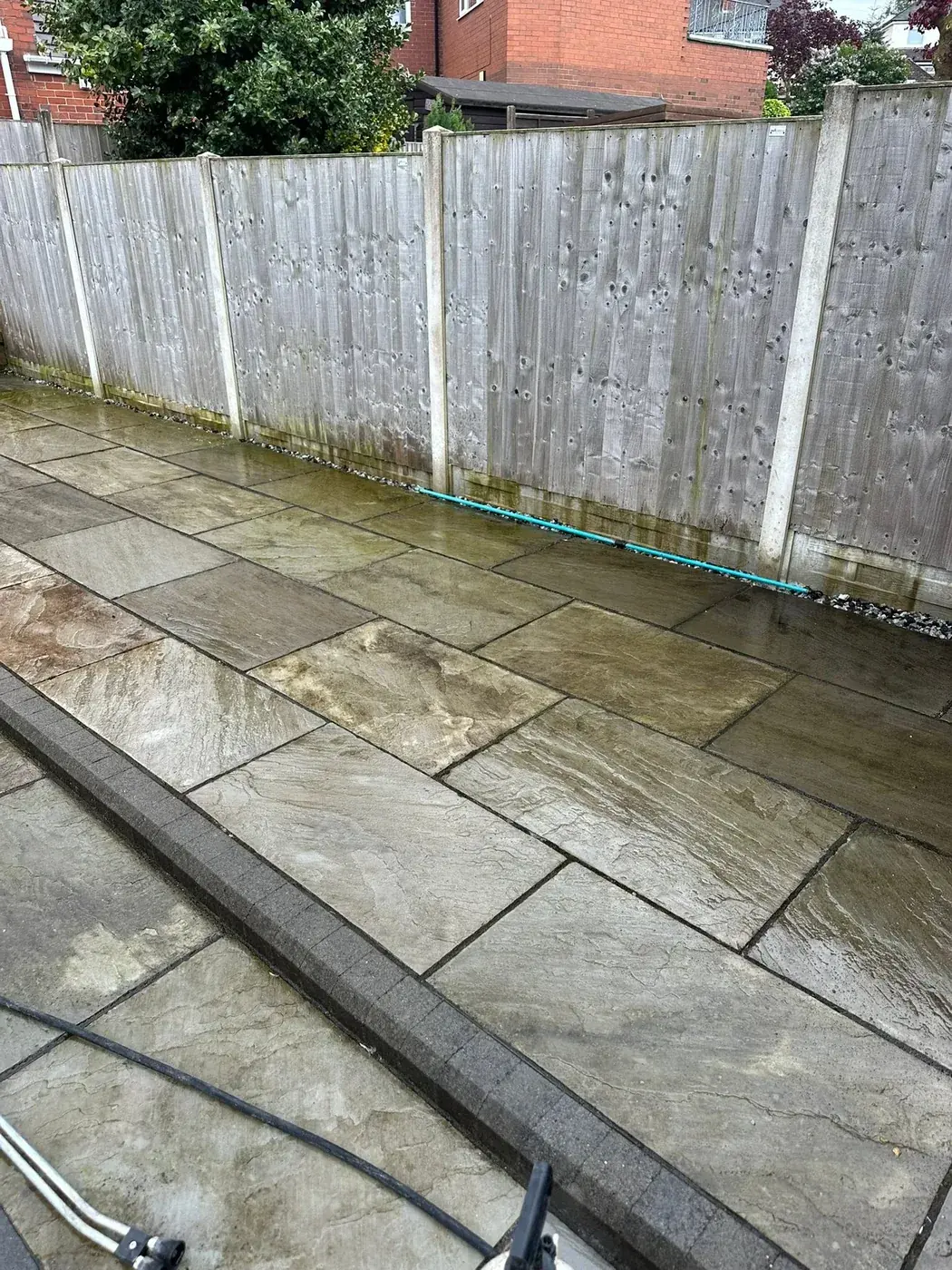 Patio during pressure washing